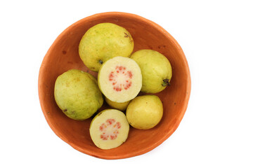 Tropical fruit from Latin America in a clay bowl. Guava from Brazil.