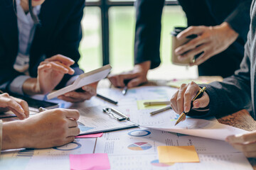 Business team analyzing income charts and graphs with modern laptop computers Business analysis and strategic thinking Startup business group meeting Young creative colleagues, close-up photo