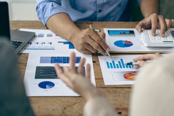 Business team analyzing income charts and graphs with modern laptop computers Business analysis and strategic thinking Startup business group meeting Young creative colleagues, close-up photo