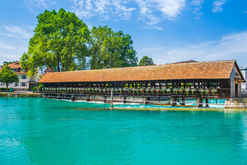 Downtown of Thun with old wooden bridge over Aare river, Switzerland