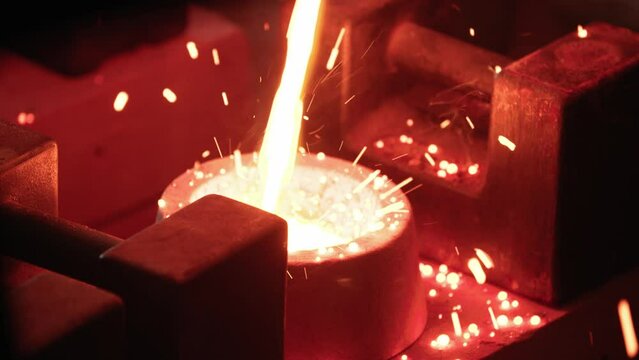 4K Closeup Molten Metal Pour into mold