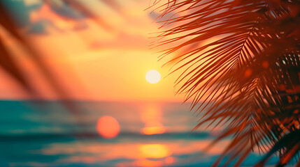 Summer vacation defocused background blurred sunset over the ocean and palm leaves