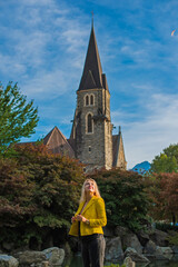 Vacation in Switzerland - Interlaken. Concept of tourism and holidays. Woman in city streets, urban...