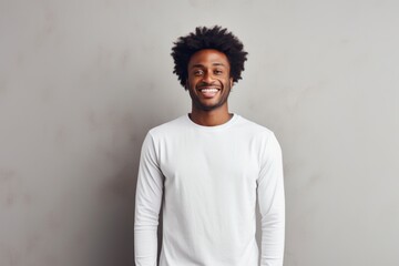 Obraz premium Portrait of a jovial afro-american man in his 30s sporting a long-sleeved thermal undershirt against a modern minimalist interior. AI Generation