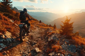 Fotobehang Motorcyclist riding on the trail in the mountains at sunset. Motocross. Enduro. Extreme sport concept. © John Martin
