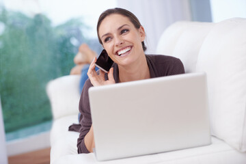 Happy woman, phone call and laptop on sofa for remote work in communication or social media. Virtual, contact and person relax in home with networking on computer online and talking on smartphone