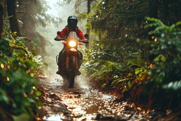 Papier Peint photo Chemin de fer Motorcyclist riding on a dirt road in the rain forest. Motocross. Enduro. Extreme sport concept.