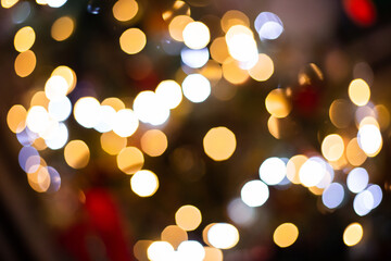 out of focus Christmas light decorations on a tree