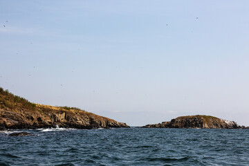 Fototapeta na wymiar View of the coast of an island from the sea