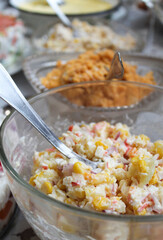 Salad in a transparent plate. Stock photo of snack.