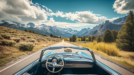 A family road trip in an open-top car driving through a scenic route with mountains in the background.