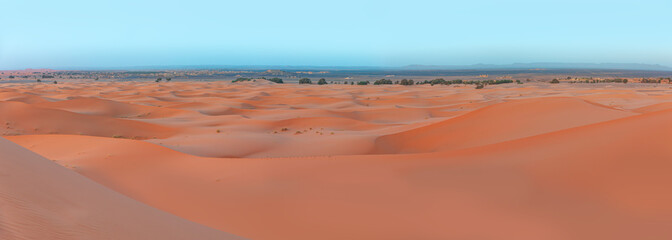 Sand dunes in the Sahara Desert at amazing sunrise, Merzouga, Morocco - Orange dunes in the desert of Morocco - Sahara desert, 