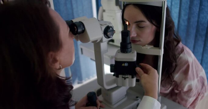 Vision test with refractometer by ophthalmologist close-up patient. Vision test crucial for eye health Vision test clinic using modern technology for eye care Emphasizing importance of eye health