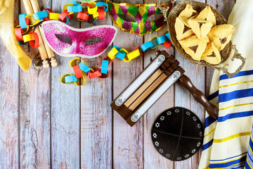 Major Jewish holiday of remembrance, Purim is associated with carnival mask hamantaschen cookies as symbols of celebration. - obrazy, fototapety, plakaty