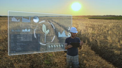 Smart precision farm industrial revolution concept, engineer work on a tablet analysing the...