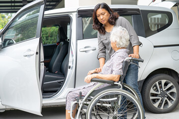 Asian senior woman patient sitting on walker prepare get to her car, healthy strong medical concept.