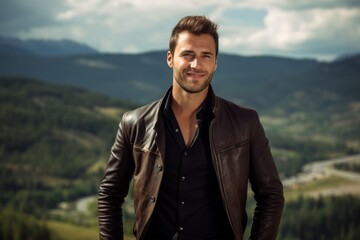 Portrait of a jovial man in his 30s sporting a stylish leather blazer against a panoramic mountain vista. AI Generation