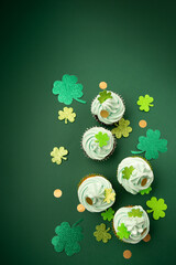 St. Patrick's Day vanilla and chocolate cupcakes with green frosting and  shiny clover decorations...