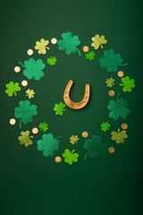 Golden Horseshoe, Gold Coins and Clover Leaves Shamrocks on Green Background for St Patricks Day...
