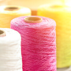 Threads in reels. Colored bobbins for embroidery knitting hobby accessories creativity.