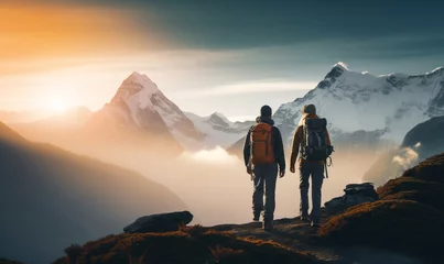 Crédence de cuisine en verre imprimé Himalaya Couple hiker traveling, walking in Himalayas under sunset light.