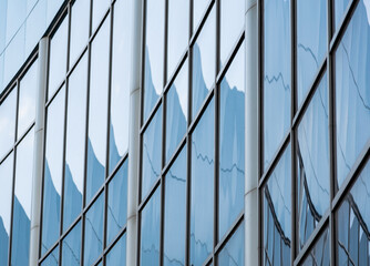 abstract background reflected in the glass windows of the building