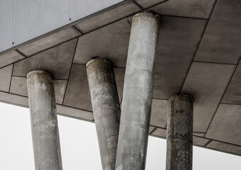 Naklejka premium fragment of gray concrete building with columns