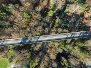 Aerial view of road bridge above forest in Switzerland.