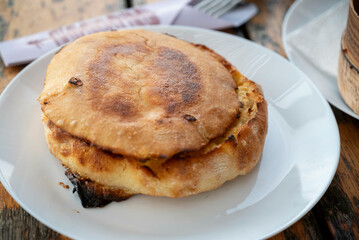 Lepinja, a traditional flat bread from Serbia, a yeast-raised, spongy flatbread that's popular all over the Balkans and similar to pide or pitta. 