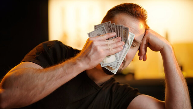 Upset man wipe tears with stack of money banknotes sarcastic meme