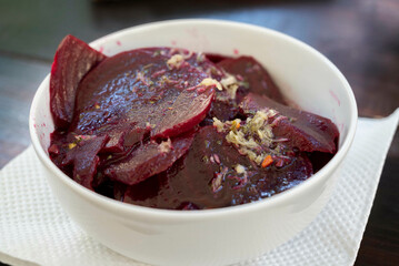 Beetroot salad, slices of boiled beet with garlic and olive oil, served in a bowl