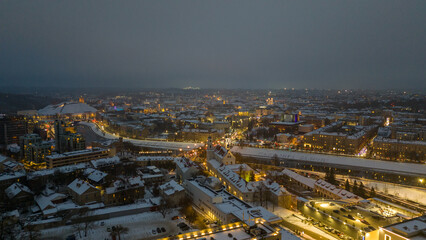 Drone photography of city old town and shinning lights during winter day