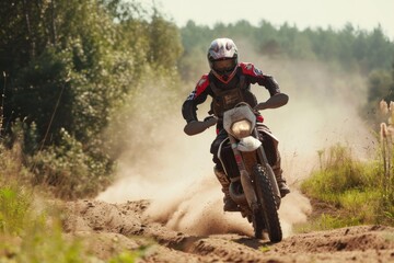 Motocross rider on the race in the forest in summer. Motocross. Enduro. Extreme sport concept.