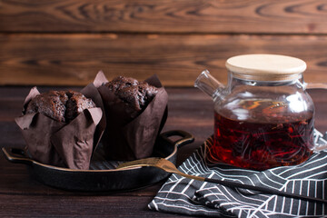 Making muffin cupcake in the kitchen. Chocolate pastries on a plate