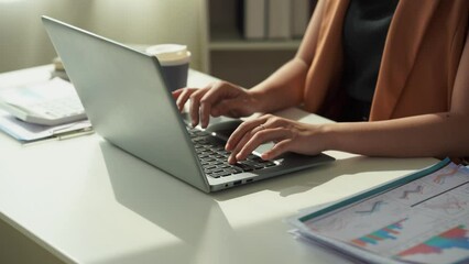 Asian businesswoman doing accounting about project plans and financial results in the office Marketing strategy analysis stock trading financial advisor 4k