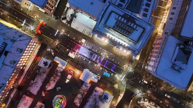 Drone footage of running event in the city old town during winter night