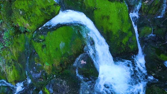 Waterfall and landscape at the source of the Cadagua River in the surroundings of the town of Cadagua in the Mena Valley. Las Merindades region. Province of Burgos. Spain. Europe