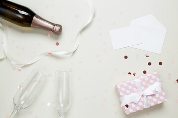 Gift for Valentine's Day, happy anniversary. A bottle of champagne and two glasses. Top view, copy space, flatlay