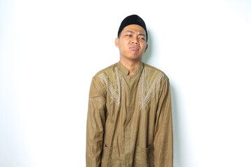 attractive asian muslim man wearing islamic clothes look depressed isolated on white background