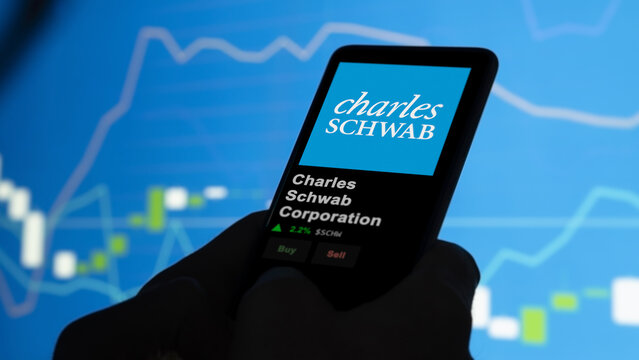 Charles Schwab Corporation on the screen of an exchange. Charles Schwab Corporation price stocks, $SCHW on a device.