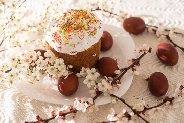 Easter cake and colored eggs. Traditional Easter baking. Easter holiday. Close-up.