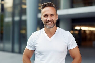 Portrait of a content man in his 40s dressed in a casual t-shirt against a sophisticated corporate office background. AI Generation