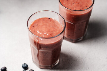 Berry smoothie, fresh blueberry, raspberry, strawberry smoothie in a glass. 