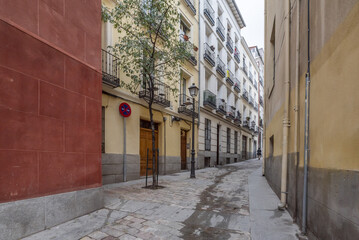 Fototapeta premium Facades of old residential buildings on a narrow pedestrian street