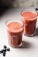Berry smoothie, fresh blueberry, raspberry, strawberry smoothie in a glass. 