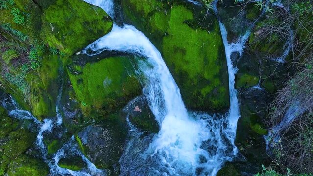 Waterfall and landscape at the source of the Cadagua River in the surroundings of the town of Cadagua in the Mena Valley. Las Merindades region. Province of Burgos. Spain. Europe