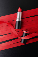 Red lipstick on ribbon background