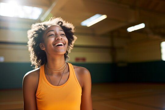 African ameican child girl on a basketball court at the school