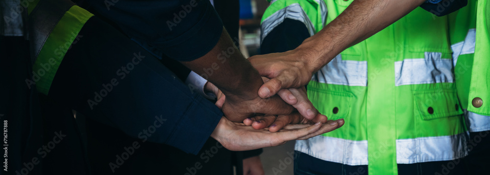 Canvas Prints Team engineers and foreman stack hand and shake hands to show success at factory machines. Worker industry join hand for collaboration.