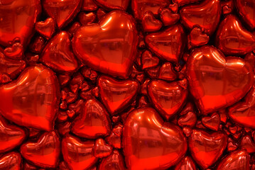 Background of red heart balloons. Festive photo zone for Valentine's Day.